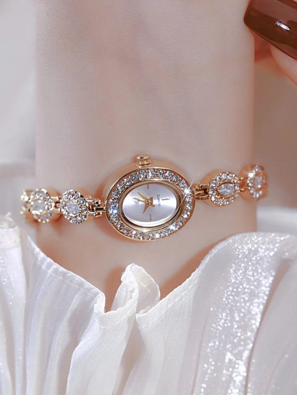 altın rengi zirkonyum taşlı saat