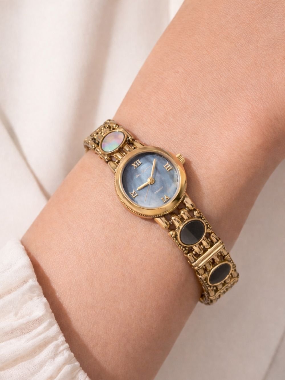 classic women watch blue stone gold finish